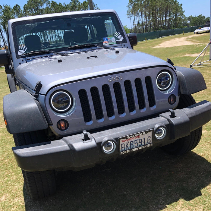 Front end of a Jeep Wrangler with 7" High Powered LED Headlights installed.