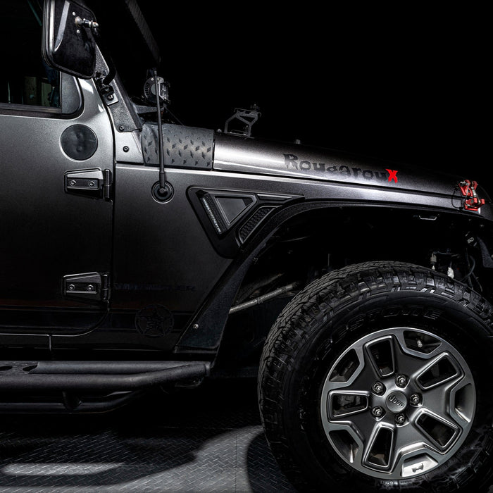 Side view of a Jeep Wrangler JK equipped with the Sidetrack™ LED Fender Lighting System.