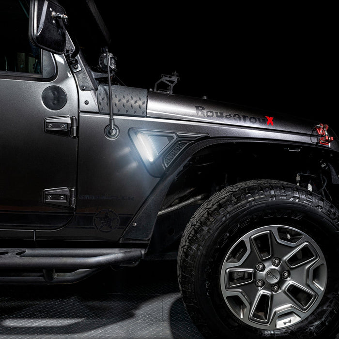 Side view of a Jeep Wrangler JK equipped with Sidetrack™ LED Fender Lighting System, with white LEDs.