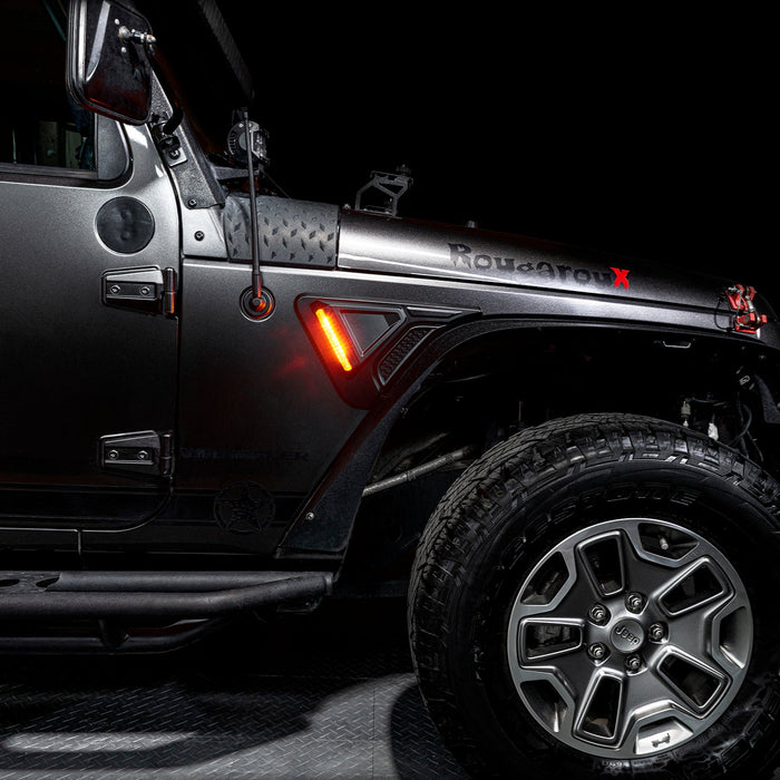 Side view of a Jeep Wrangler JK with the Sidetrack™ LED Fender Lighting System installed, set to amber LEDs.