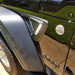 Close-up of Sidetrack™ LED Lighting System installed on a Jeep, with white LEDs on.