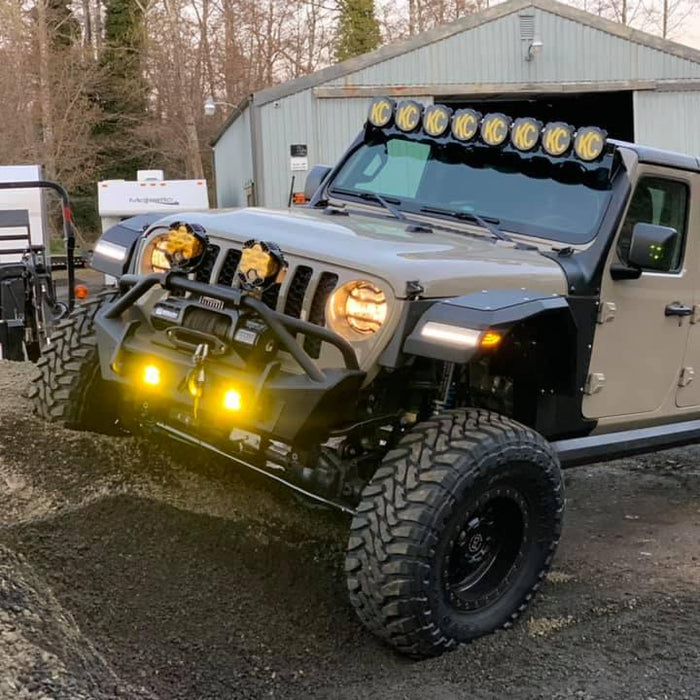 Three quarters view of a Jeep Gladiator with multiple LED lighting products installed, including "Smoked Lens" LED Front Sidemarkers.