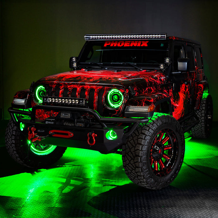 Three quarters view of a red Jeep Wrangler JL with High Performance 20W LED Fog Lights installed, and green halos on.