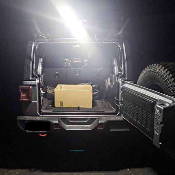 Rear view of a Jeep Wrangler with Cargo LED Light Module installed and turned on.