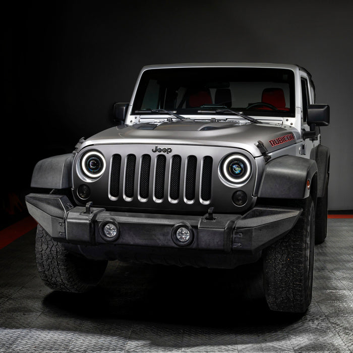 Front view of a Jeep Wrangler JK with 7" Oculus Headlights installed, with white halos on.