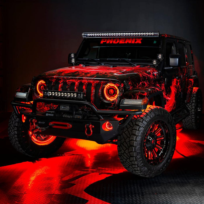 Three quarters view of a red Jeep Wrangler JL, with ColorSHIFT Oculus Headlights, and red halo rings.