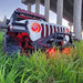 Front end of a Jeep with ColorSHIFT Oculus Headlights installed.