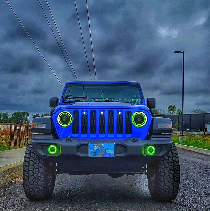 Front view of a Jeep with ColorSHIFT Oculus Headlights installed, and green halos on.