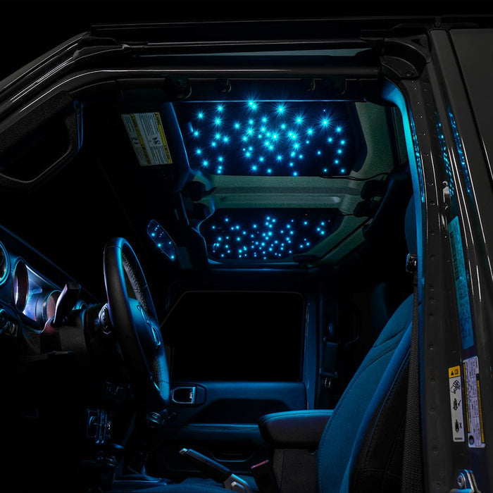 Jeep interior with StarLINER Fiber Optic Hardtop Headliner installed on the roof panels, set to cyan LEDs.