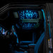 Jeep interior with StarLINER Fiber Optic Hardtop Headliner installed on the roof panels, set to cyan LEDs.