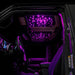 Jeep interior with StarLINER Fiber Optic Hardtop Headliner installed on the roof panels, set to pink LEDs.