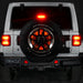 Rear end of a white Jeep with LED Illuminated Spare Tire Wheel Ring Third Brake Light installed.